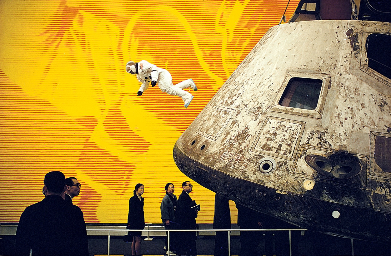 Photo of patrons waiting to see space shuttle in museum