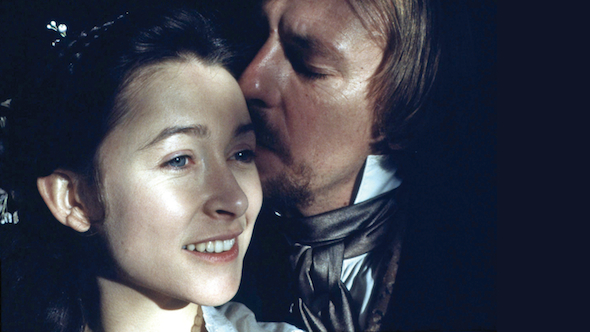 Movie Still in color of young white man kissing a young white woman