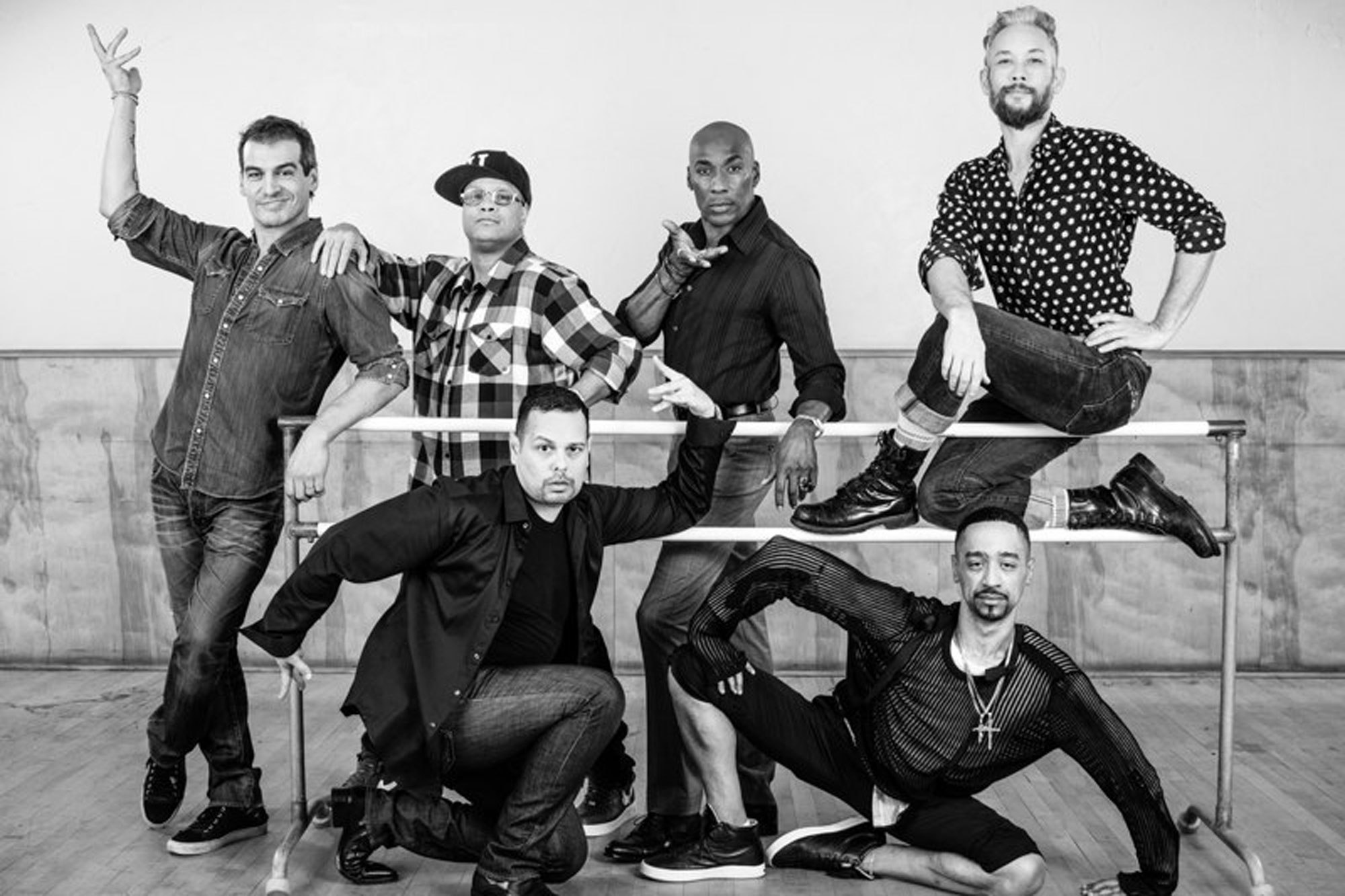 Black and white image of six people striking a pose