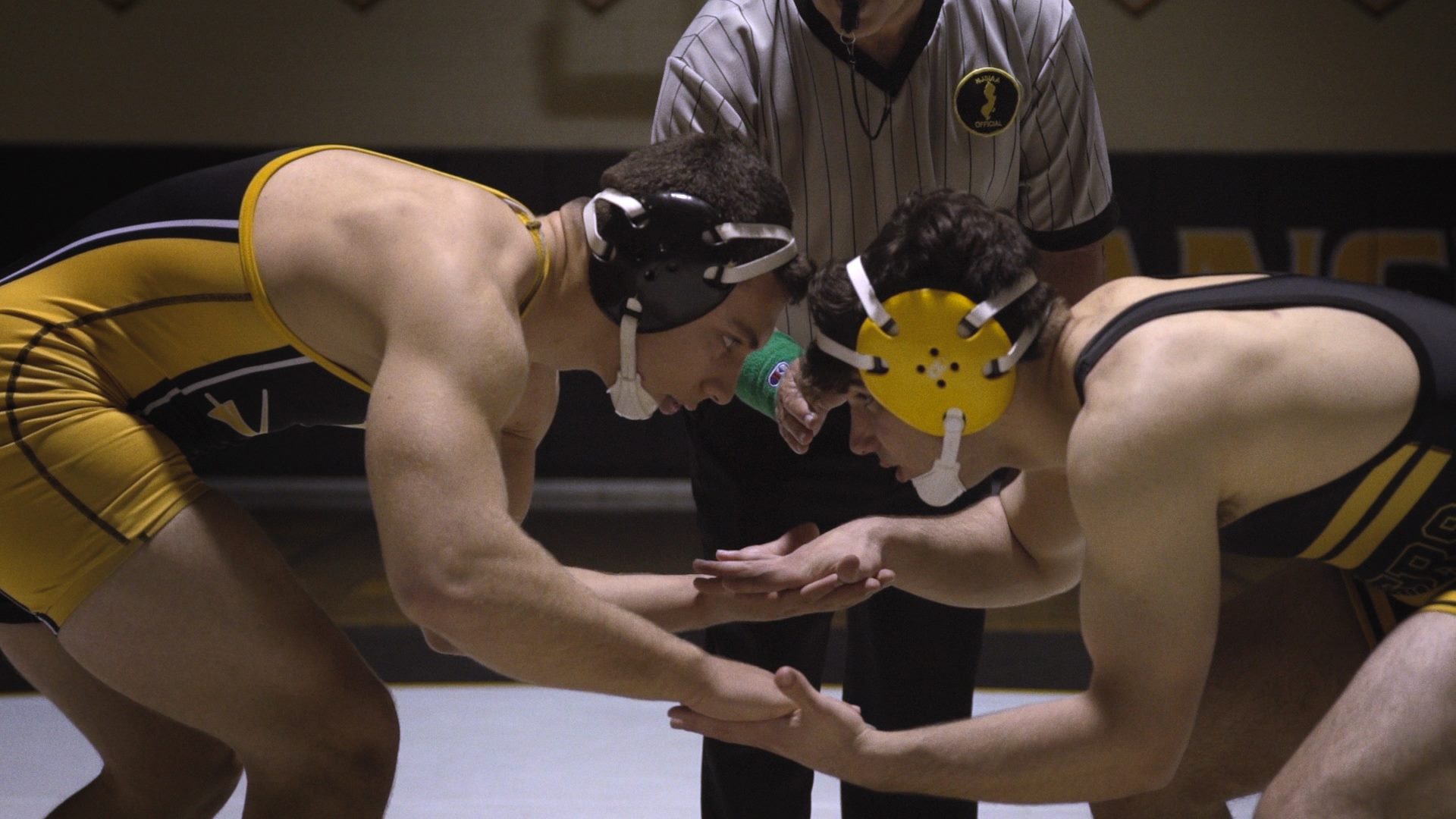 Film still of two high school wrestlers in "A Shot in the Dark"