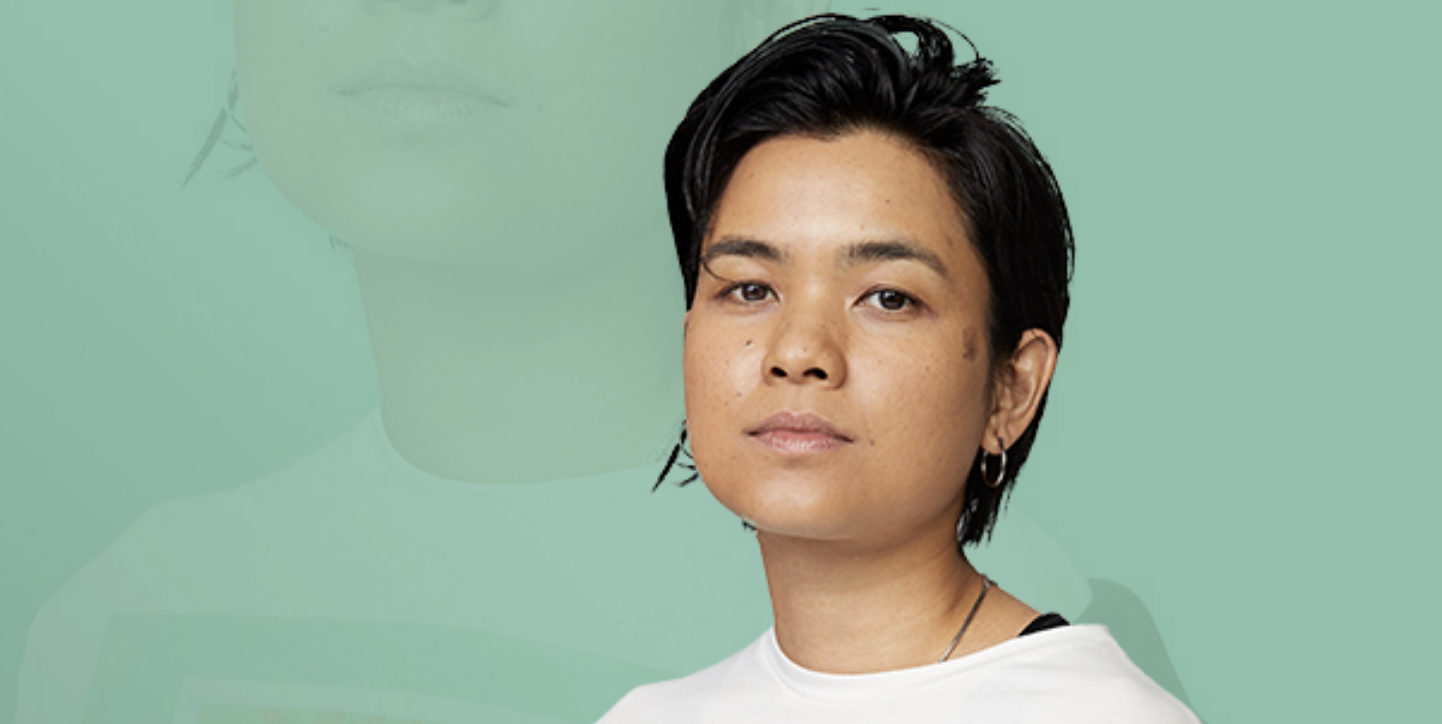 Headshot of young woman with short black hair