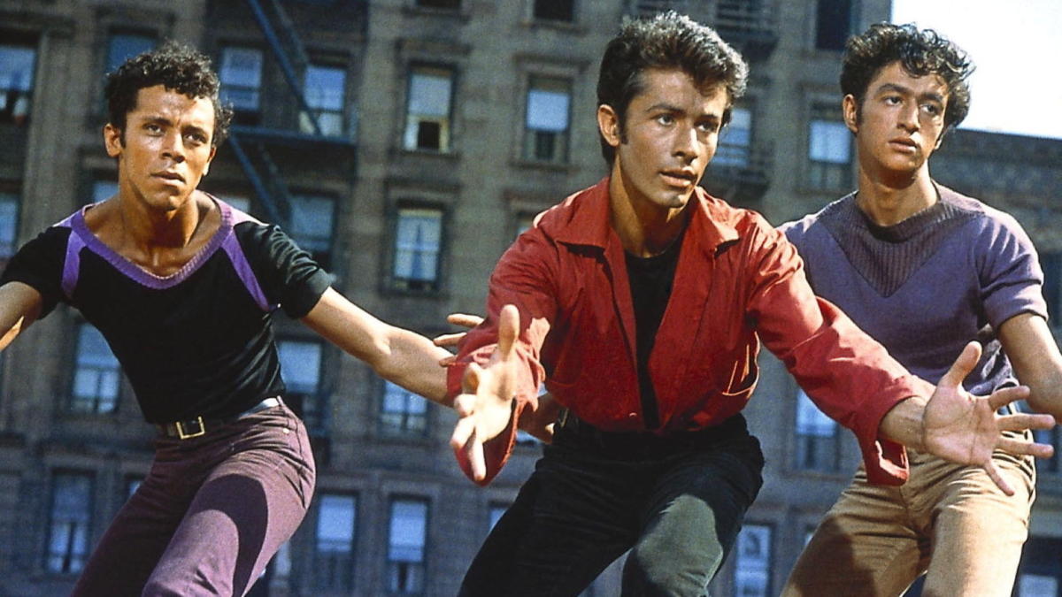 George Chakiris and two dancers in the film "West Side Story"
