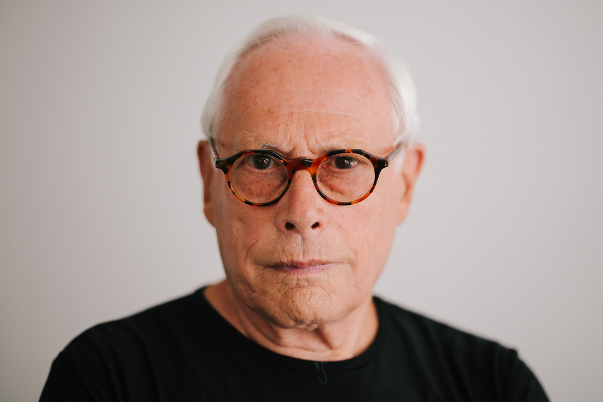 Older white man with tortoise shell glasses