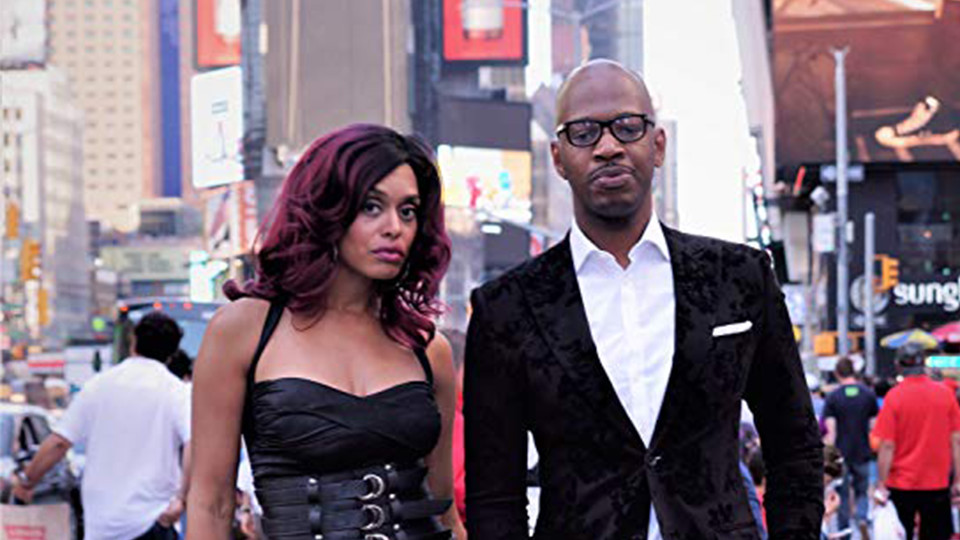 Mr & Mrs Jackson standing in Times Square