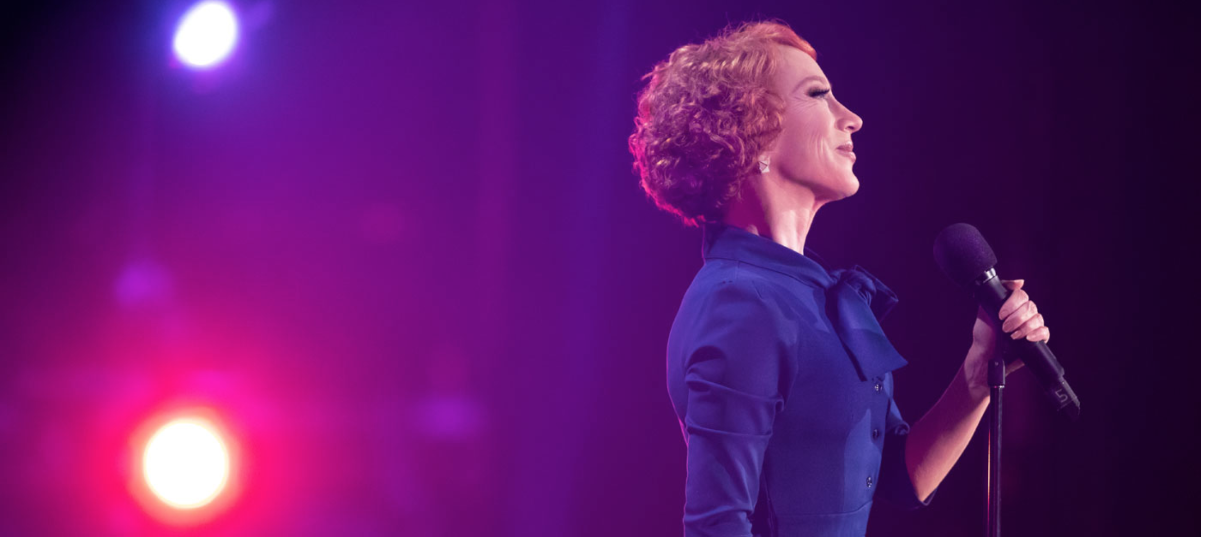 Kathy Griffin at a microphone
