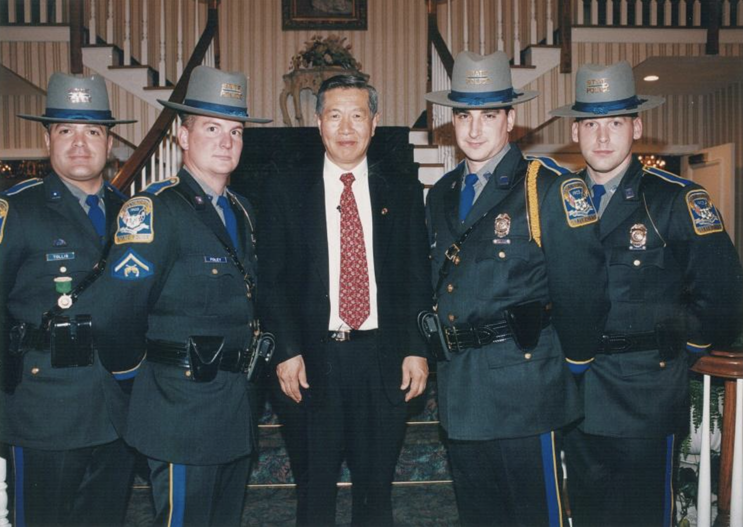 Dr. Henry C. Lee with 4 officers
